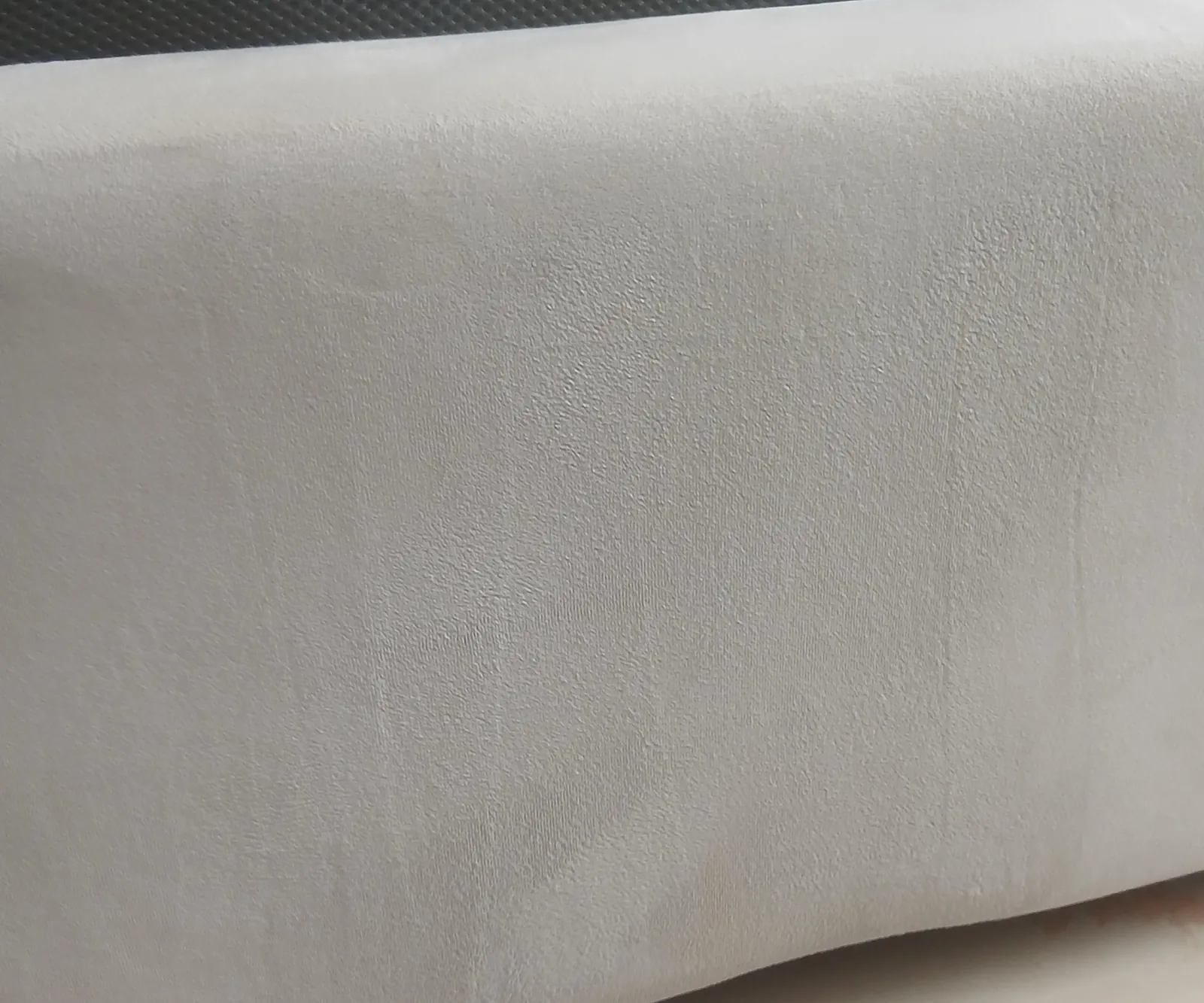 Makeup foundation stain on an upholstered bed base, After